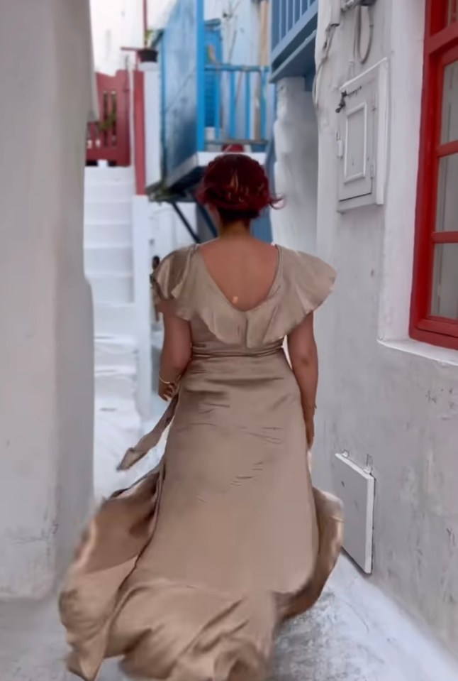 Her dress billowed as she walked through the town