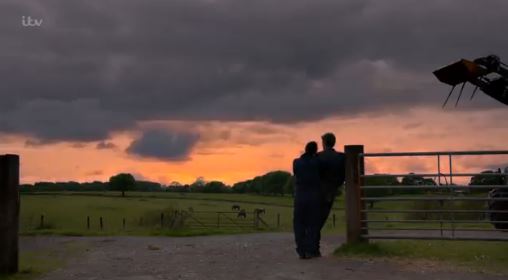 The pair stood in a field during the emotional scene