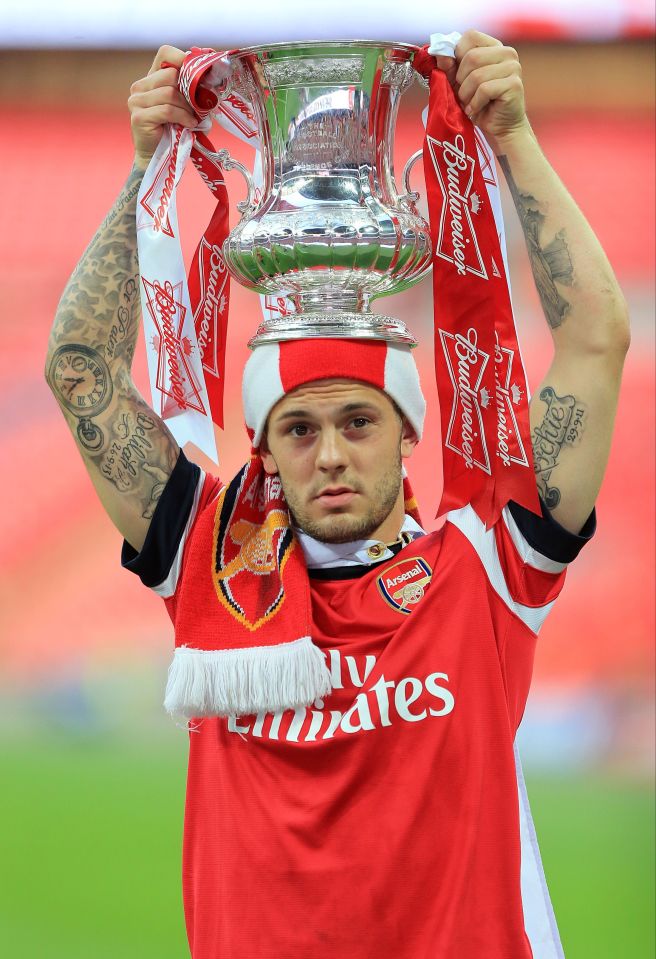 He won the FA Cup twice during his time playing for Arsenal