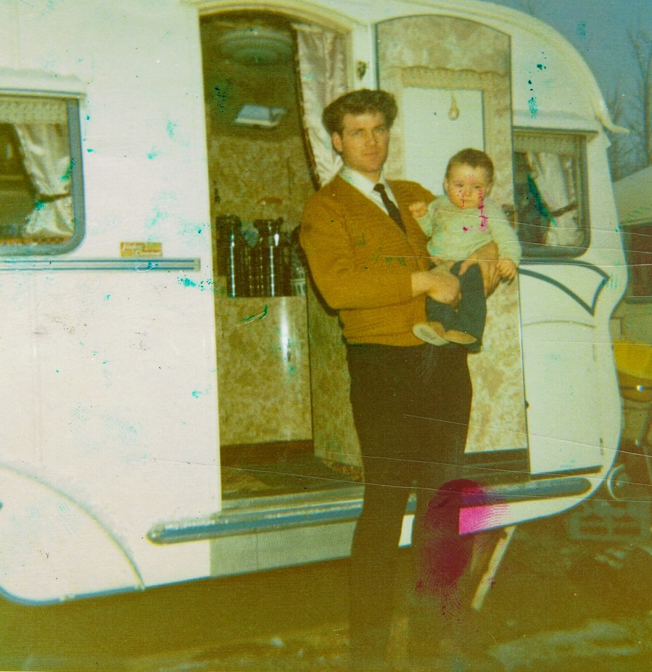 Alfie was born in a caravan by the side of a road (pictured with his dad as a child)