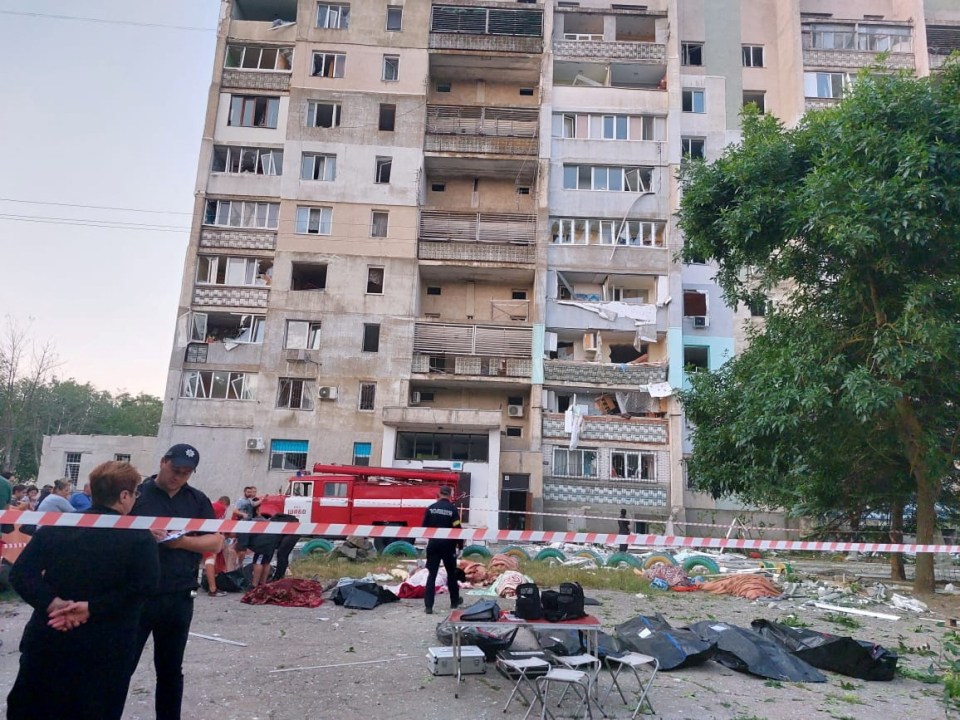 Bodies of people killed by the Russian missile strike in front of an apartment building