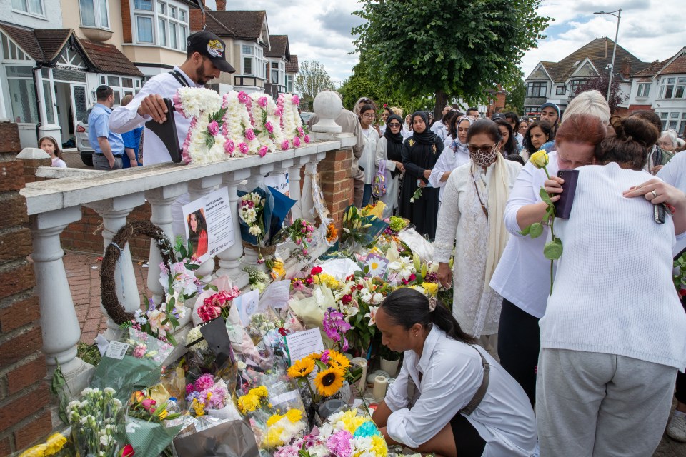 Supporters hugged and laid flowers for the lawyer