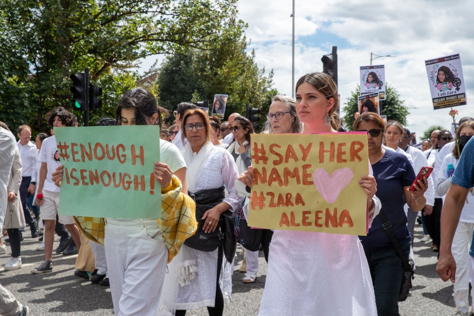 Some people held flowers and pictures of Zara