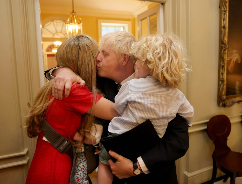 Mr Johnson was comforted by his wife and children after delivering his resignation statement