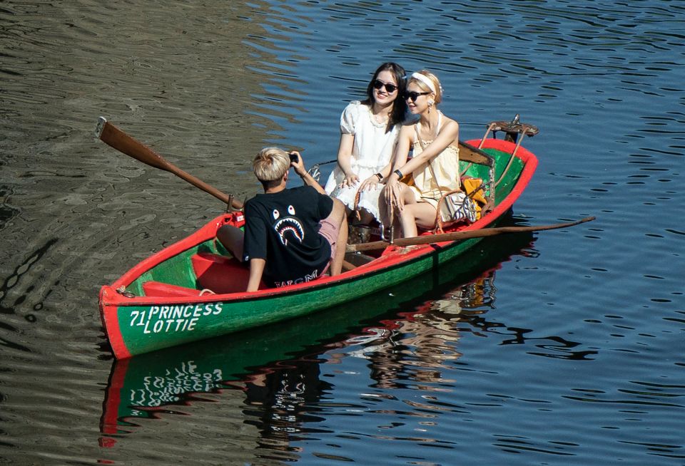 People in a row a boat enjoy the hot weather on the River Nidd in Knaresborough, North Yorkshire