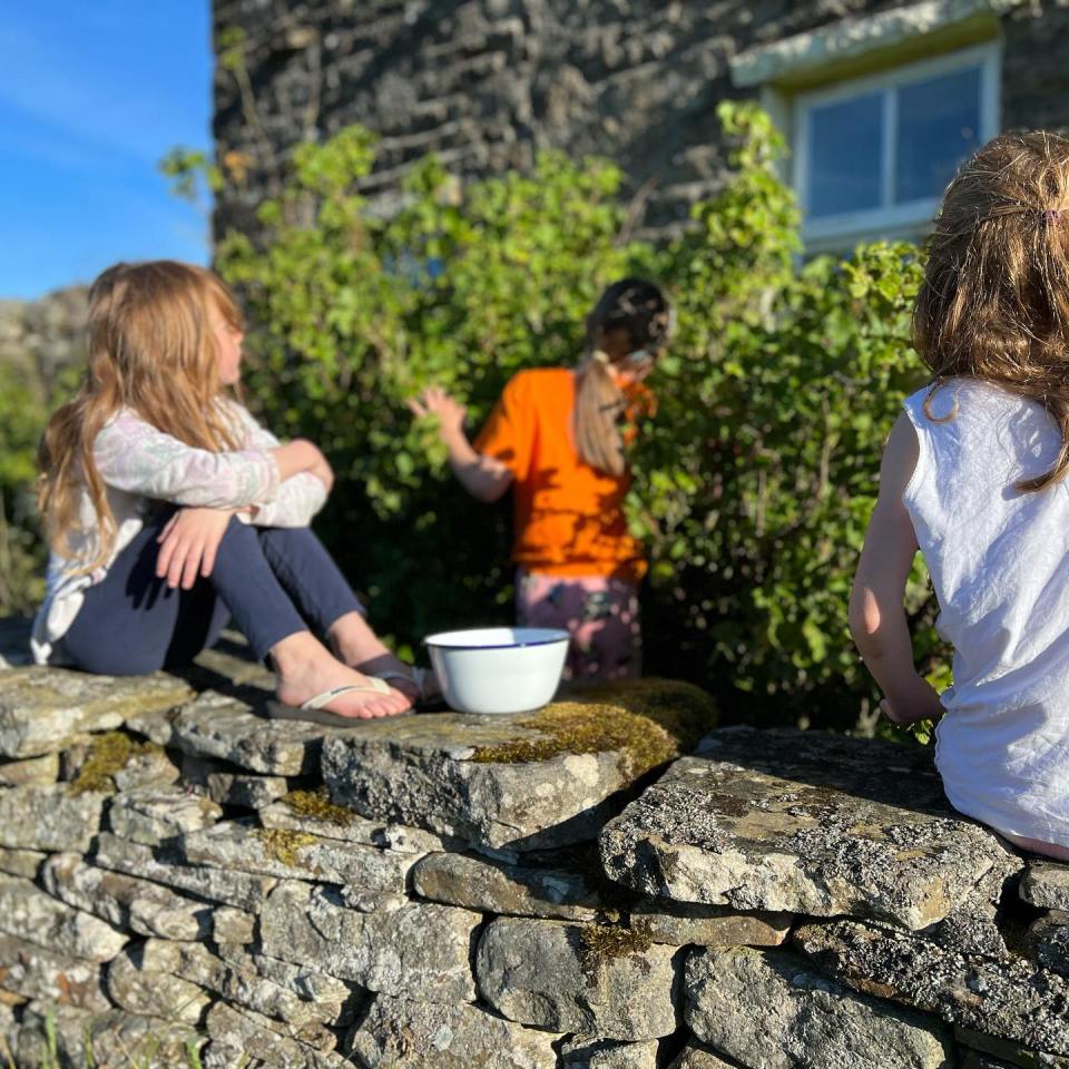 Three of Amanda and Clive's daughters enjoy a morning of blackcurrant picking