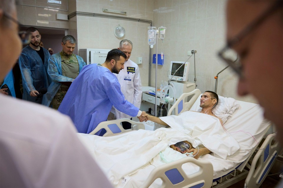 President Volodymyr Zelensky meets an injured soldier before praising the bravery of his frontline forces