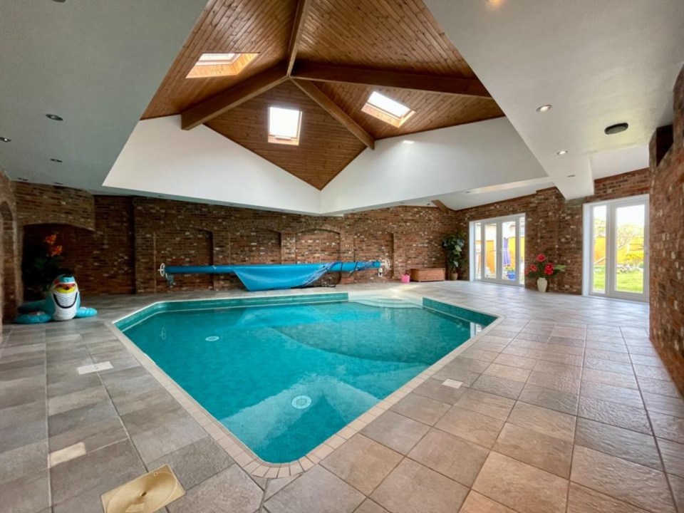 An indoor swimming pool can be found in the building's extension, perfect for cooling off during heatwaves