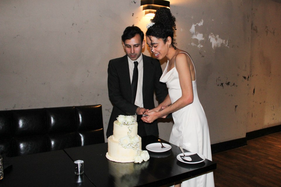 Jillian cutting cake with her husband