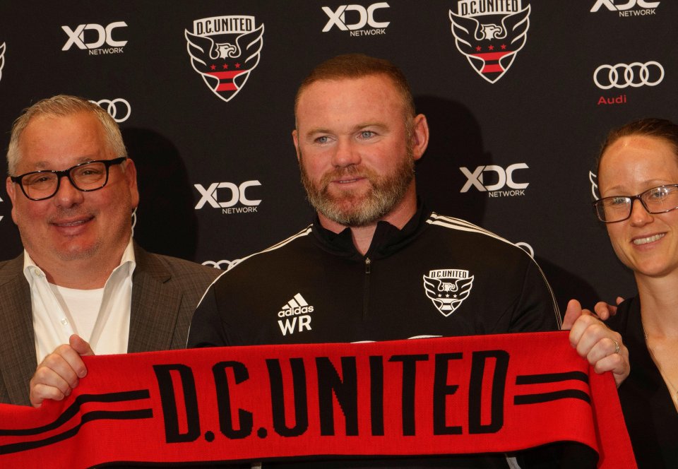 Wayne Rooney is flanked by General Manager Dave Kasper and Head of Technical Recruitment Lucy Rushton during his DC United unveiling