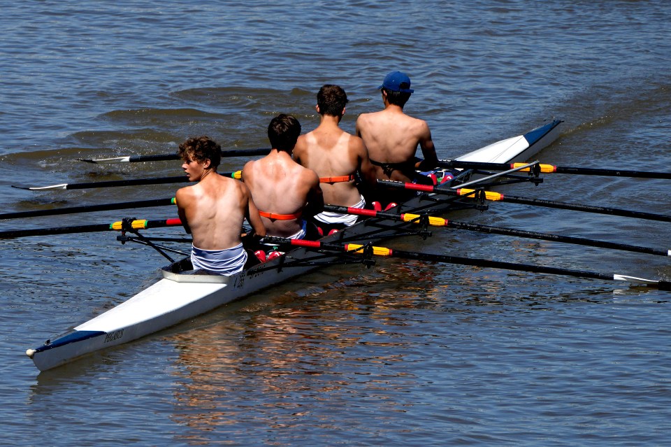 Partially suntanned rowers enjoy the sunny weather on the river Thames near Hammersmith on Friday