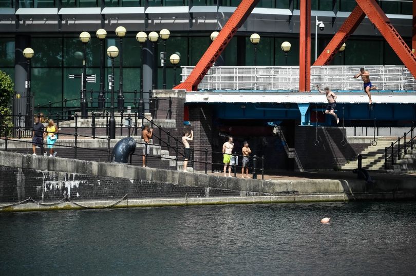 Lads were spotted hurling themselves into the water in Salford Quays despite the death of a boy on Saturday