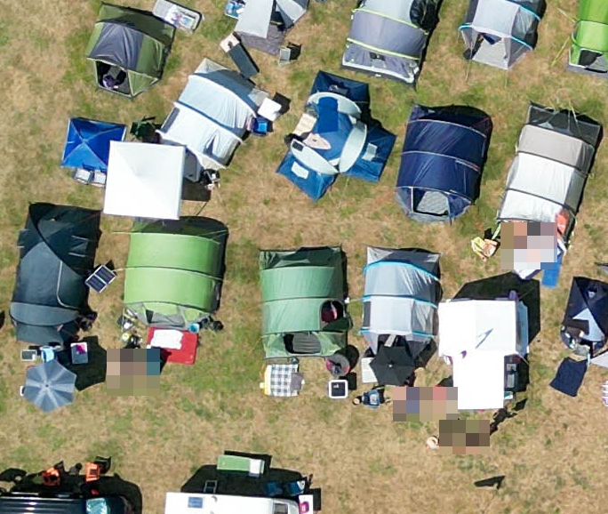 Around 30 tents also pitched up, with naked sunseekers seen cooling off in the heat