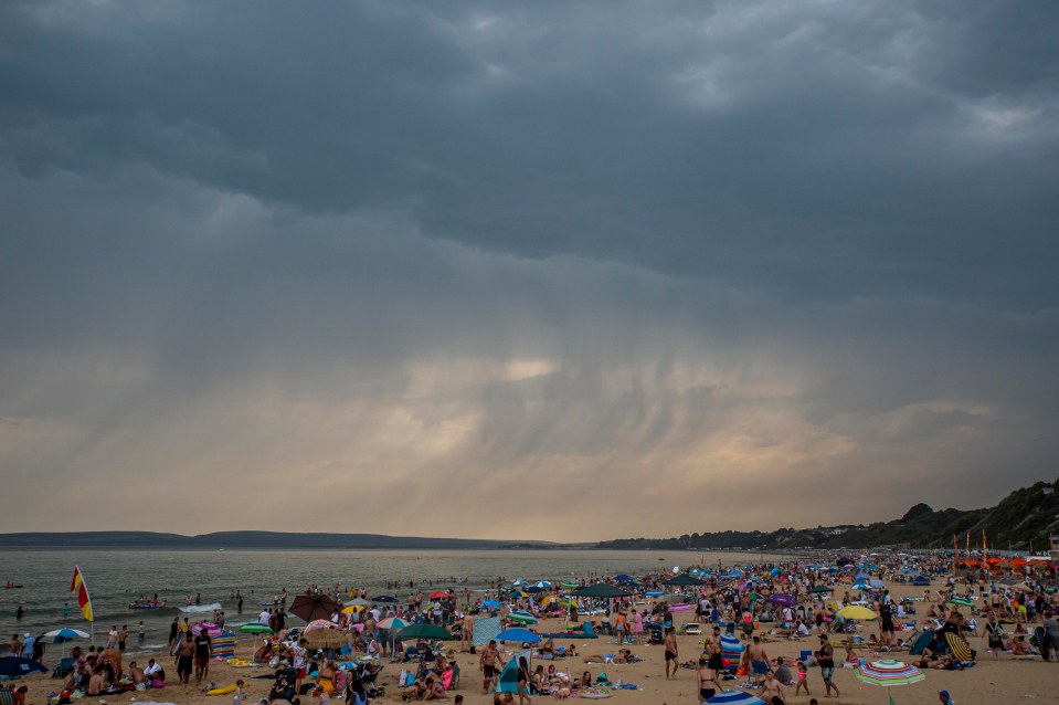 Sunbathers pictured in Bournemouth on Tuesday