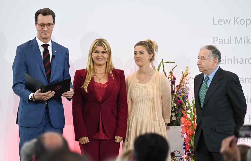 Todt with Michael's daughter Gina and wife Corinna accepting an honour on behalf of the F1 icon