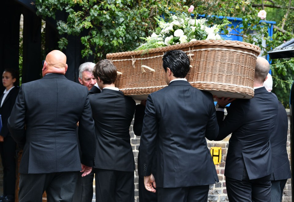 Deborah's coffin was carried by mourners including son Hugo