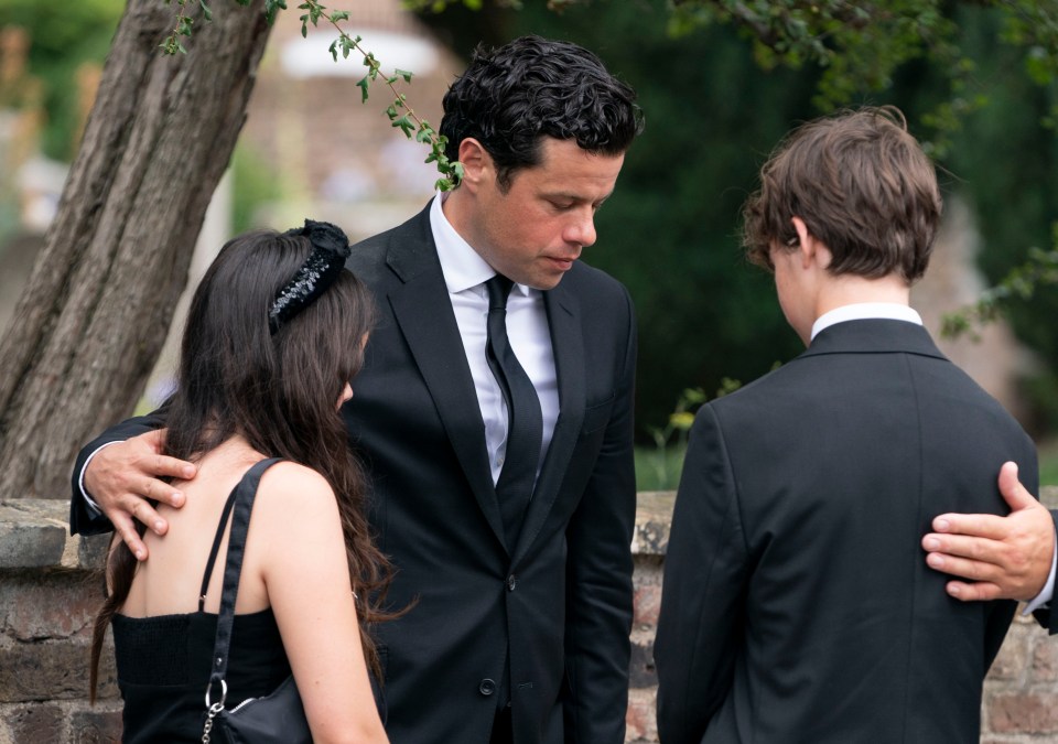 Deborah James' children Eloise and Hugo hugged their dad as they left the church today her funeral