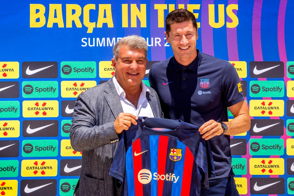 Joan Laporta, left, with Robert Lewandowski