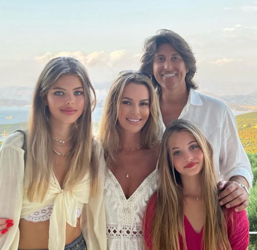 The star has jetted off on holiday with her husband and their two daughters