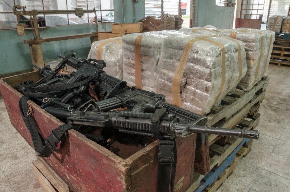 A warehouse packed with machine guns and packets of cocaine