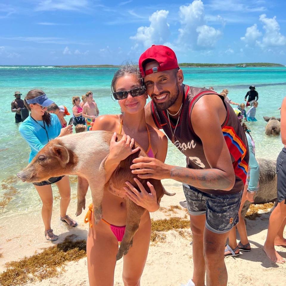 Nick Kyrgios and Costeen Hatzi enjoyed meeting the pigs on holiday