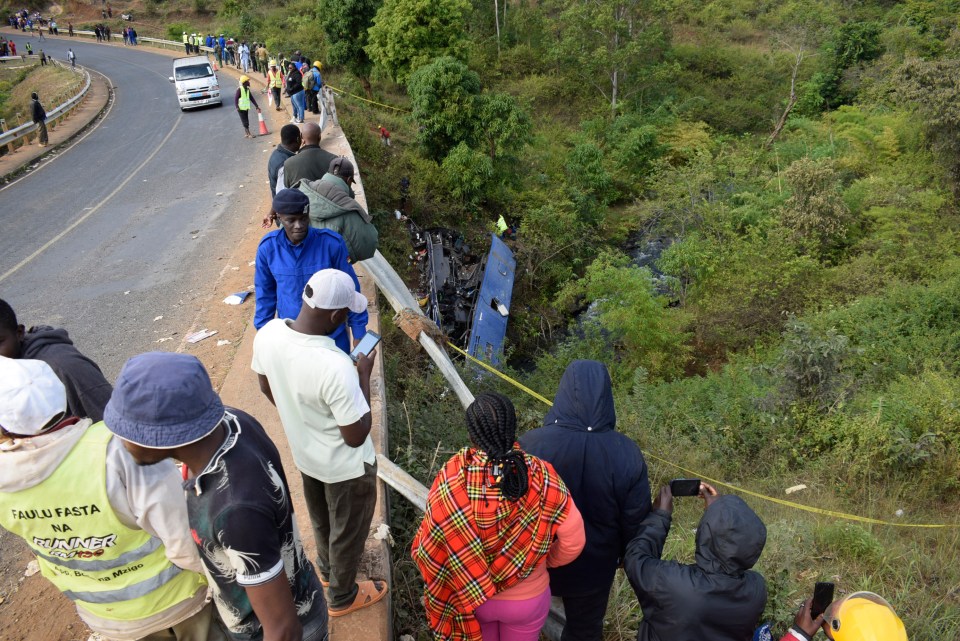 Horrified onlookers watched on as rescue crews dealt with the aftermath of the smash