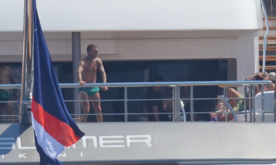 David Beckham could be seen topless as he soaked up the sunshine