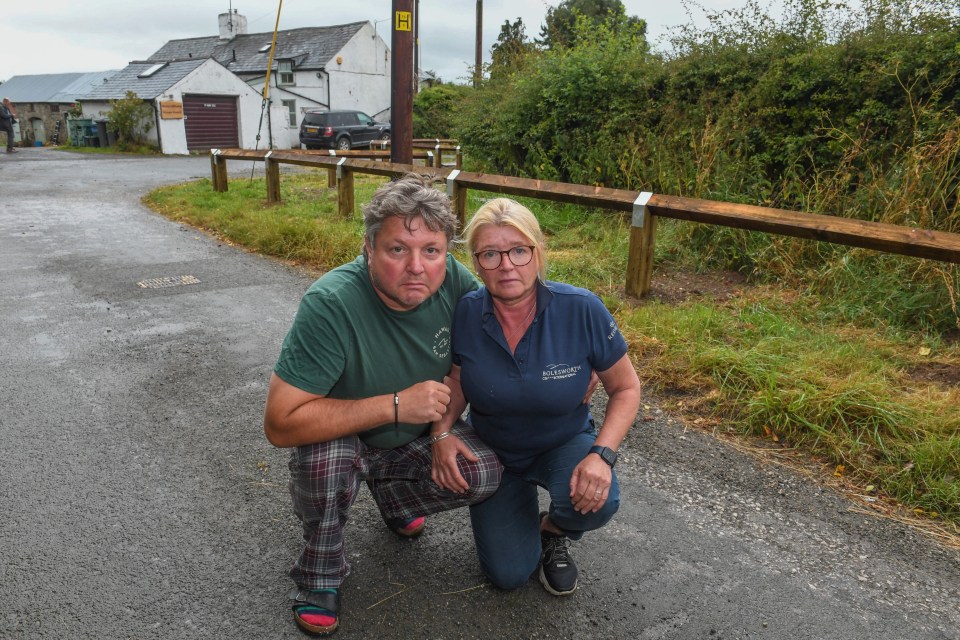 James and Tracey Woodbine are furious after the council installed a long fence to stop them parking near their home