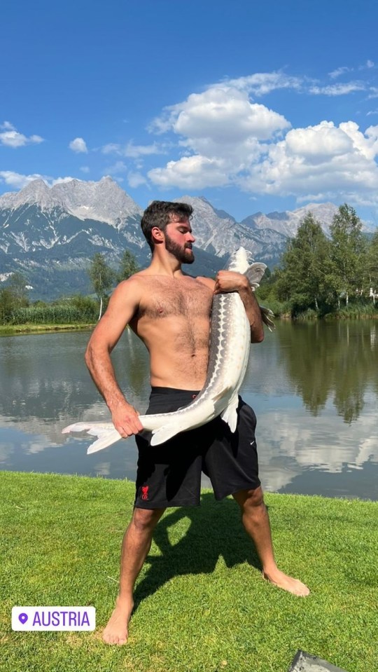 Keeper Alisson wrestled to keep hold of his big catch