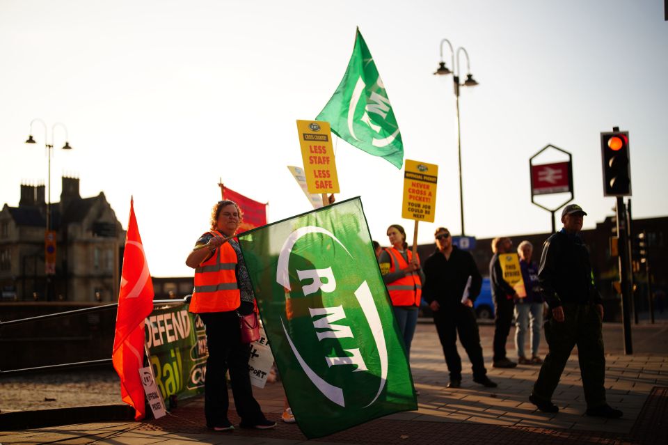 Members of the RMT wait on the picket line outside Bristol Temple Meads train station