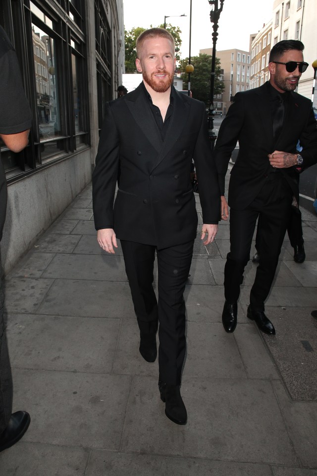 Neil looked very smart in a black suit and shirt