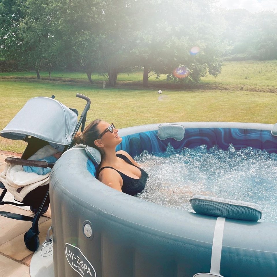 Sam looked totally relaxed in her Lay-Z Spa in her new garden