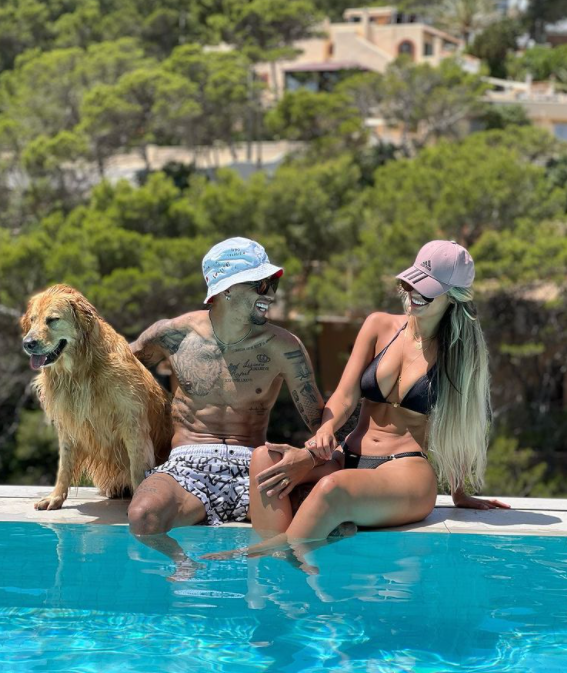 The pair shared family snaps on Instagram posing with their dog