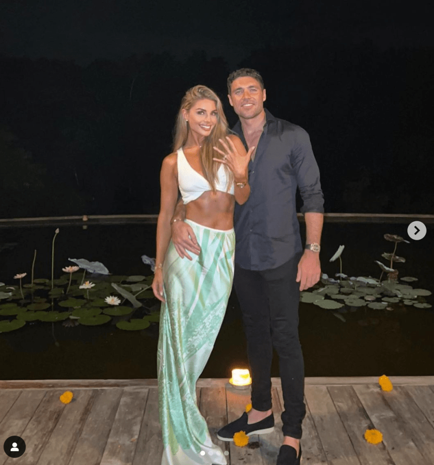 Rebecca flashes her gorgeous ring as the couple pose for snaps