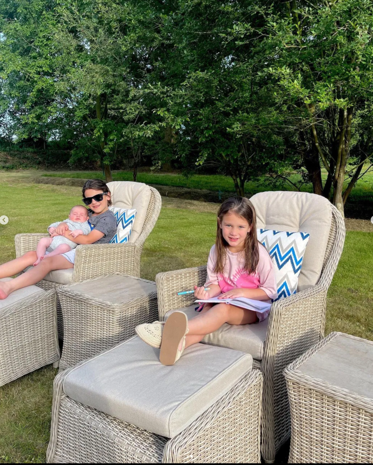 Her kids looked delightful relaxing on colourful scatter cushions on the garden furniture