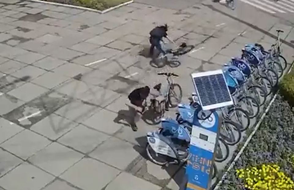 People cycling through the square flee for their lives as debris flies through the air