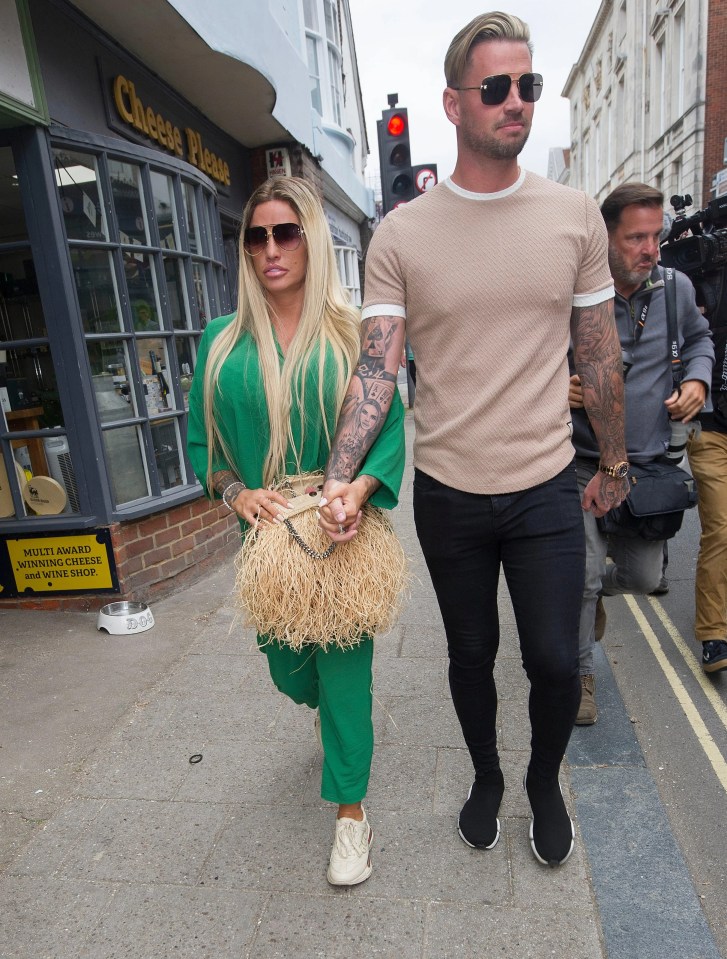 Katie Price, pictured with Carl Woods outside Lewes Crown Court, has faced a difficult few months