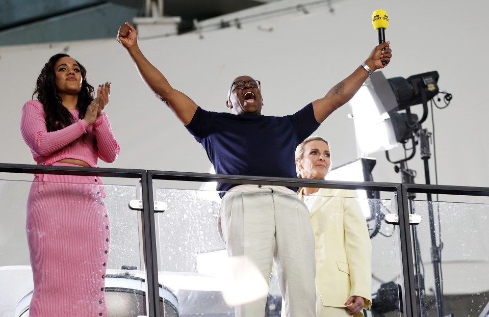 Ian Wright celebrates alongside Gabby Logan and Alex Scott