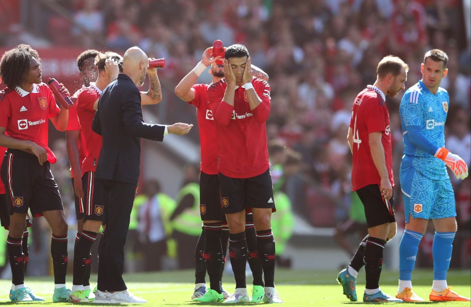 Cristiano Ronaldo covers his face during a talk with Ten Hag