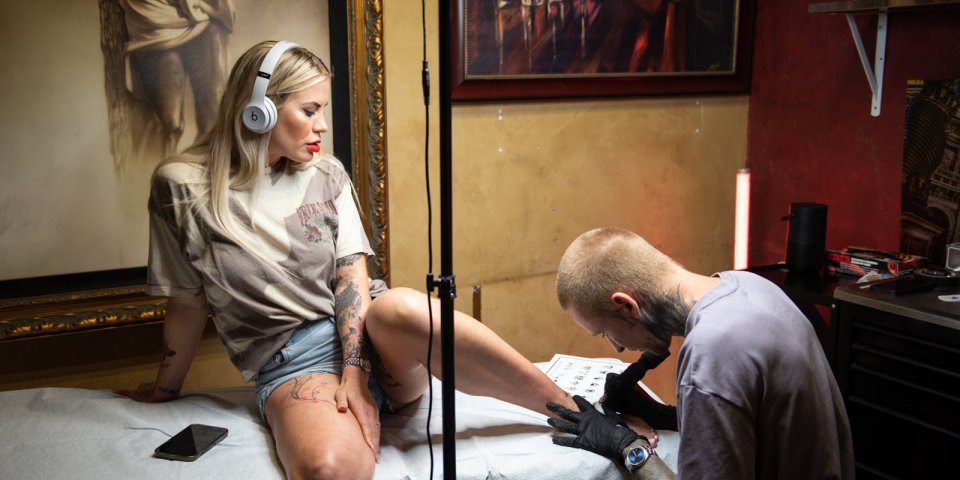 A woman gets her flash tattoo in LA.