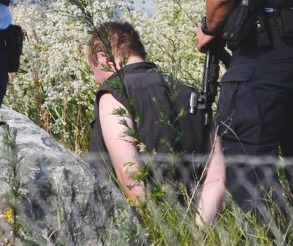 The Copenhagen shooting suspect is seen cuffed on his knees after the bloody rampage that left three dead