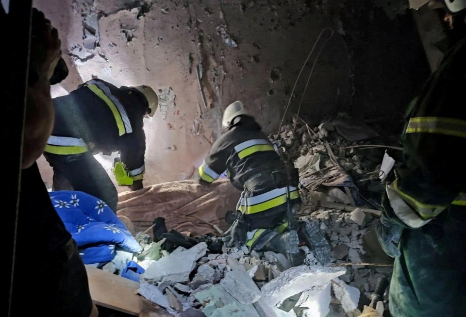 Rescuers searching through the rubble for survivors