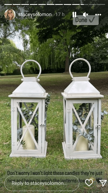 She painted some old lanterns white to fit in with the wedding theme