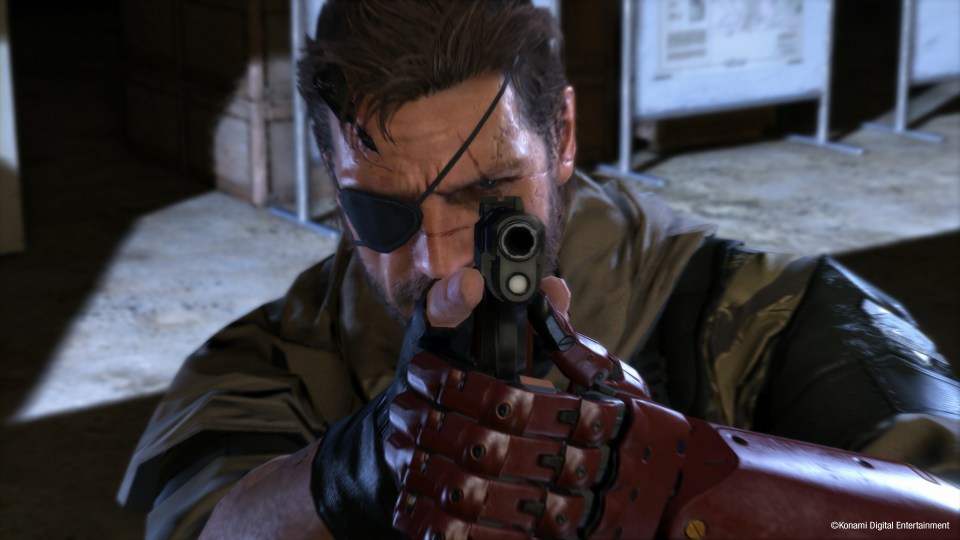 Snake points a gun at the camera