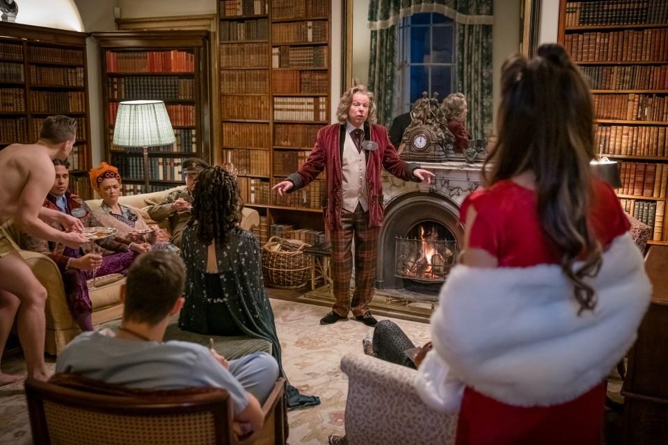 While Vinnie and Jim break into the cellars and steal the wine, the rest of the group are meant to be distracting the guests upstairs