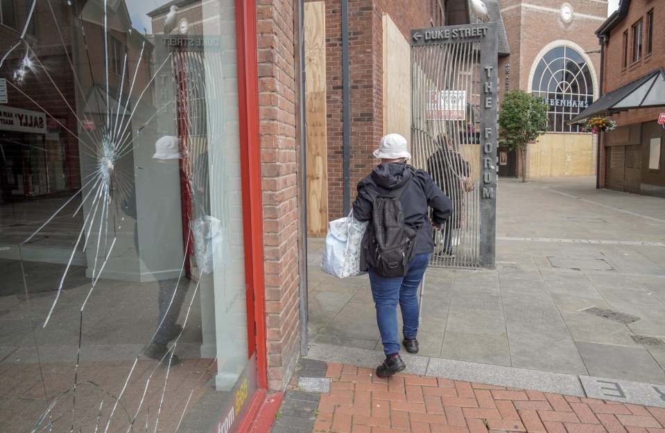 Many high street shops sport smashed windows in Barrow