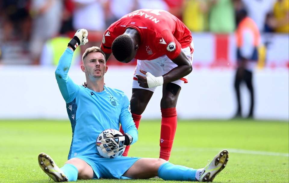 Dean Henderson celebrates after saving a penalty against West Ham