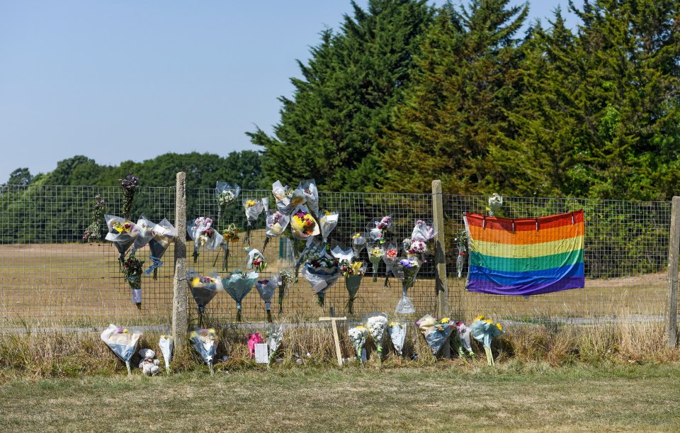 Bouquets of flowers lay at the scene today