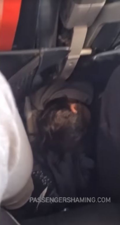 The video showed the child's head just inches from the feet of the passengers in the row behind