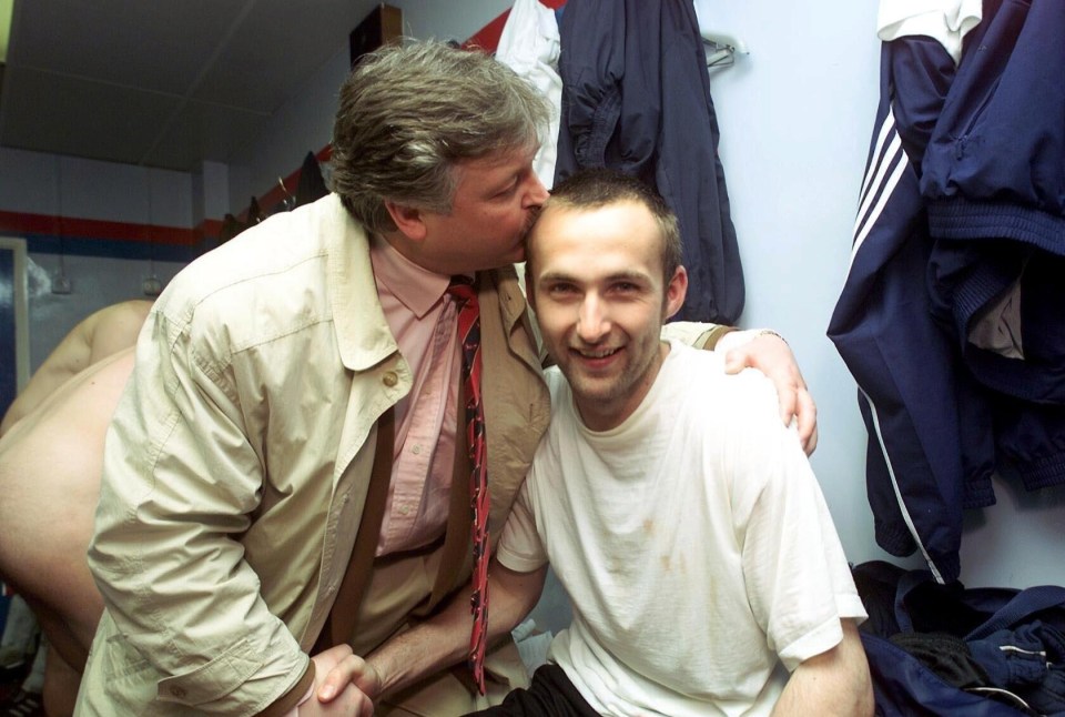 Knighton lays a kiss on Jimmy Glass after the goalkeeper's heroic goal